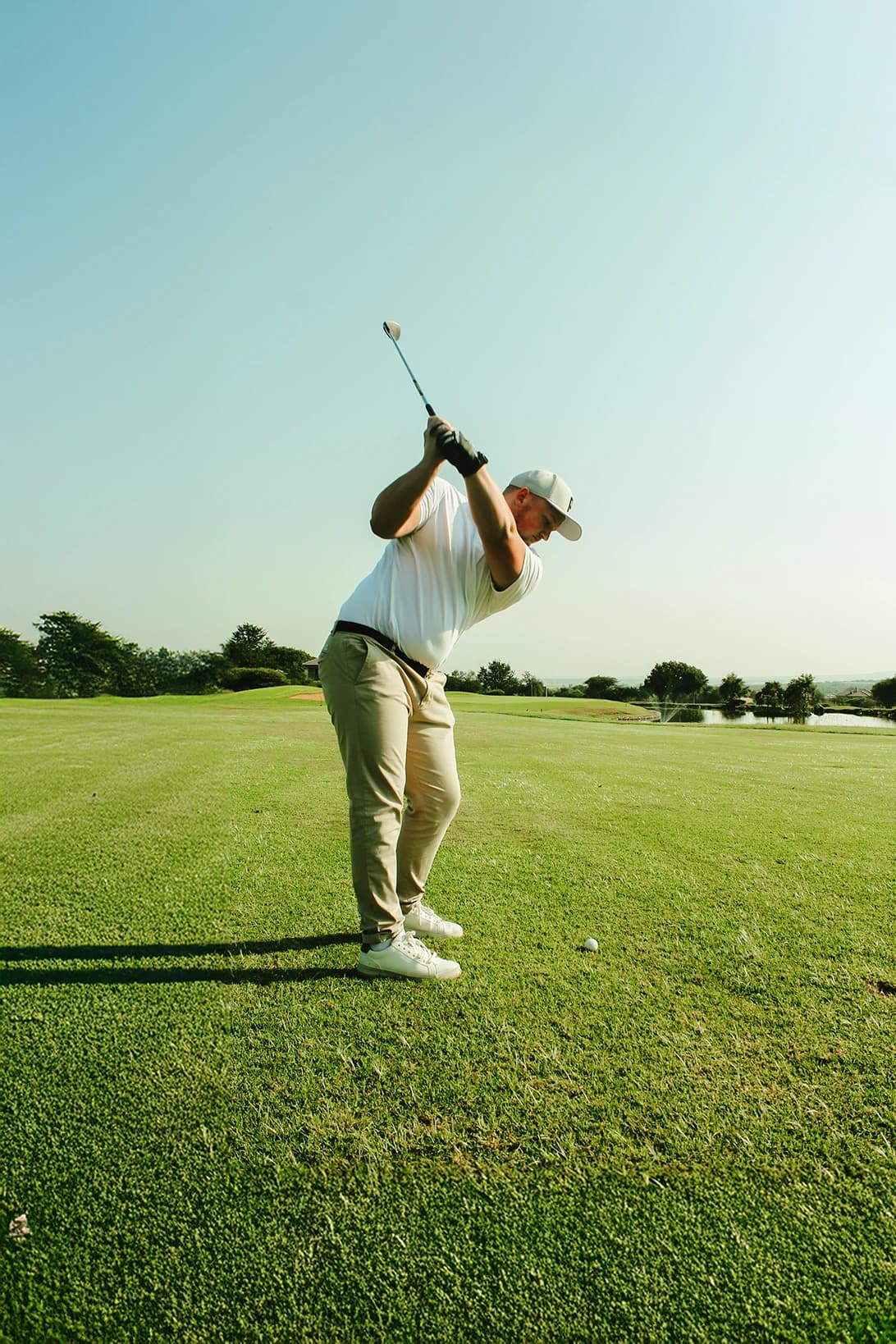 Golfer mid-swing